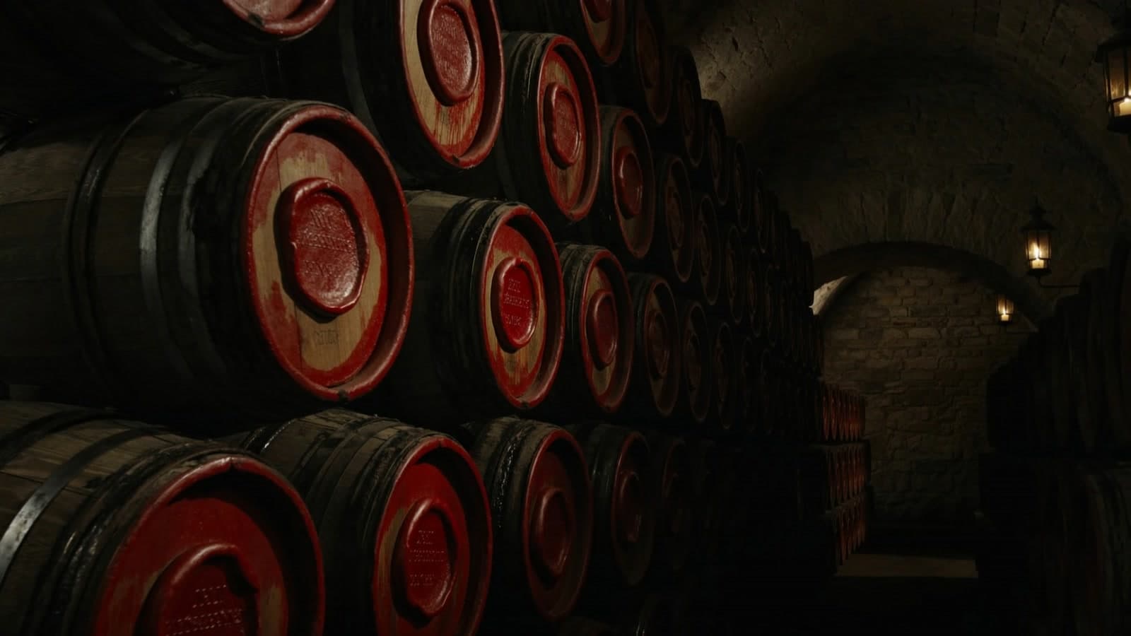 Oak barrels stacked in a vaulted stone cellar, every barrel head sealed with red wax, candle lanterns glowing on the wall toward a far arch