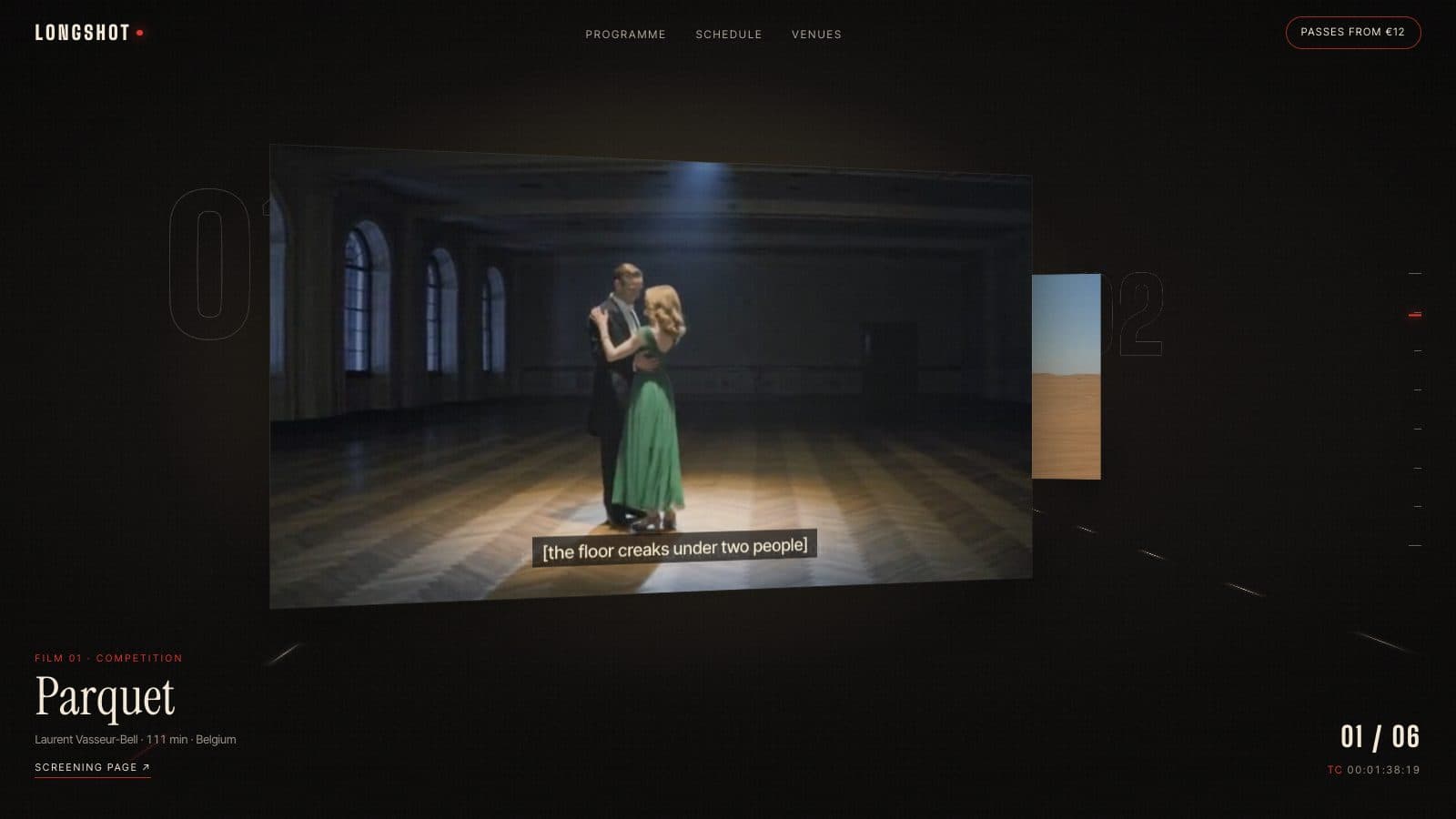 A film still of a couple slow dancing in a spotlit ballroom hanging as a screen in a dark 3D corridor